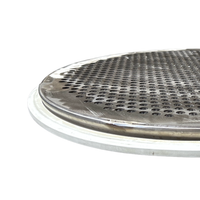 Close-up of a round punch plate screen, which is a perforated plate welded to a round screen ring