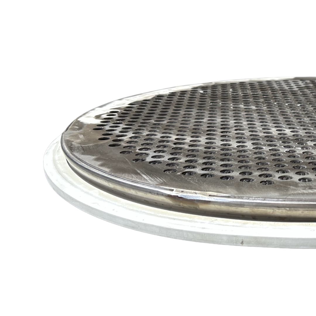 Close-up of a round punch plate screen, which is a perforated plate welded to a round screen ring
