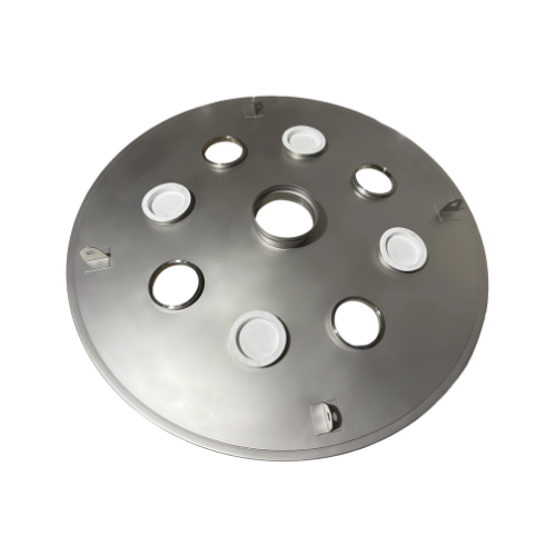 Our custom stainless steel cover for a round vibratory screener, built with a center inlet, 4 capped inspection ports, and 4 connector collars — 9 penetrations in a single lid.