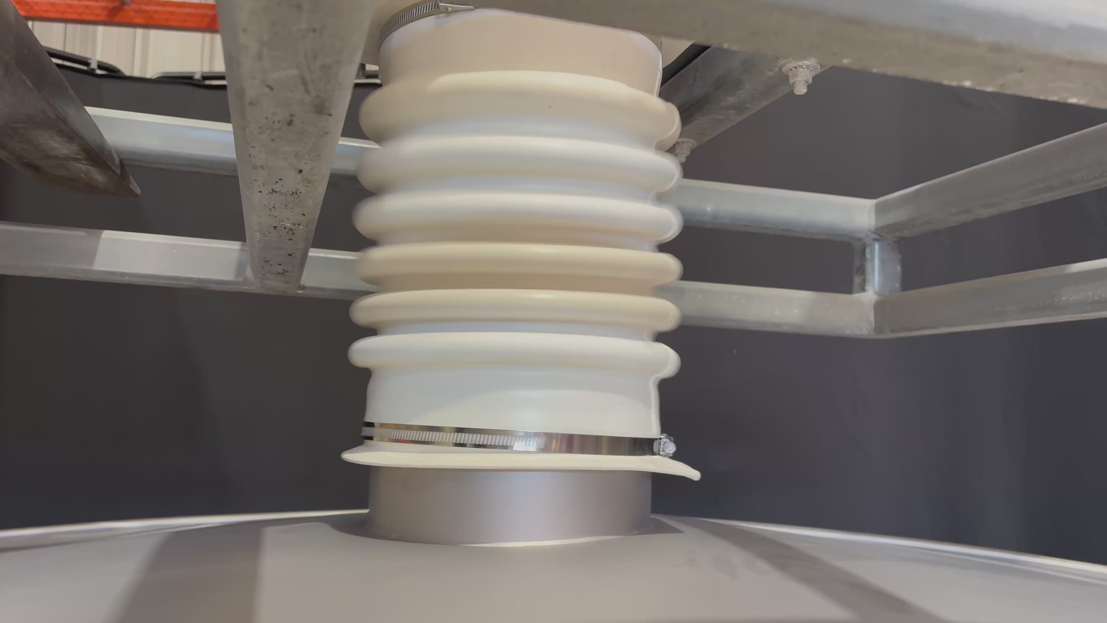 Connector Boot connected to machine cover inlet with clamp